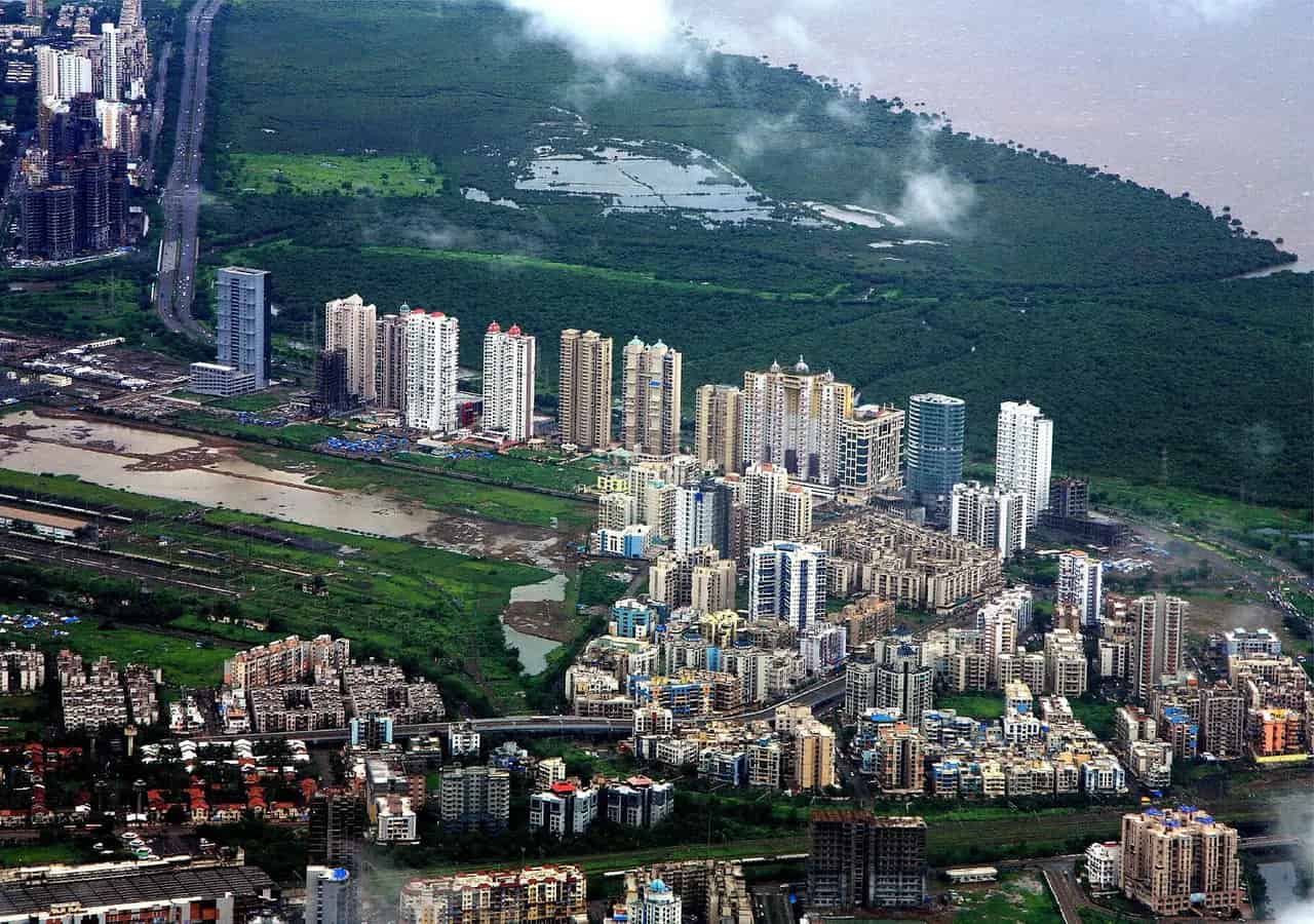 Urban skyline and greenery in Navi Mumbai. Location context only; this is not a portrait of Vijaya Menon.